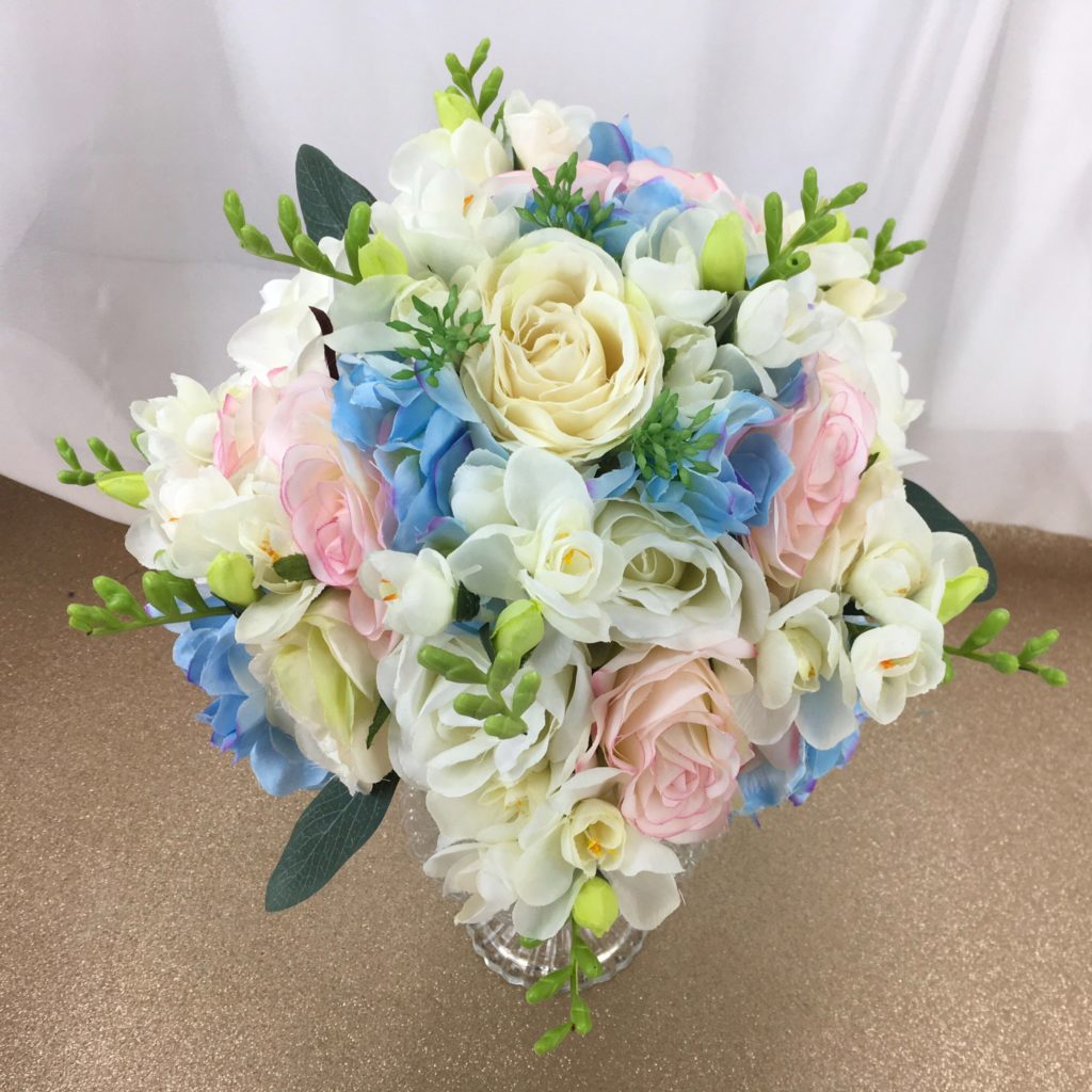 artificial silk flower bridal bouquet. blue, ivory, white, pink, cream. hand tied posy style inc freesia, roses, hydrangea