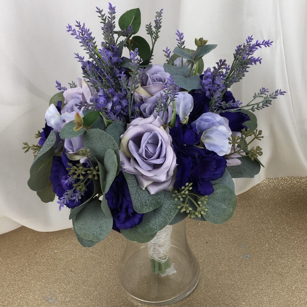 artificial silk flower brides bouquet. hand tied posy style purple, lavender, ivory, green. inc roses. lissianthus, lavender, berry & eucalyptus