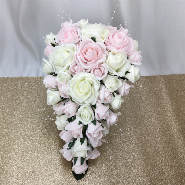 artificial bridal bouquet, heart shaped inc foam roses, rose buds.