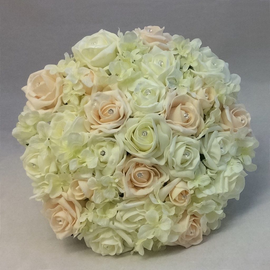 artificial bridal bouquet, colorfast foam flowers. compact posy style soft muted colours, ivory, blush, peach , inc roses hydrangea