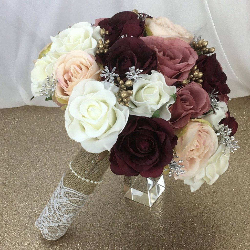 artificial silk flower brides bouquet. hand tied compact posy style. inc variety of roses, berries and foam roses