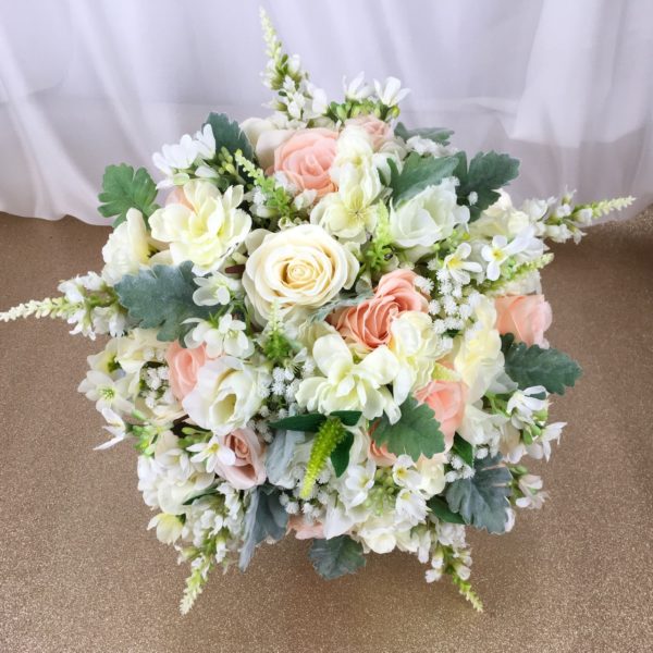 artificial silk flower bridal bouquet. hand tied posy style. ivory, cre3am, peach, apricot, vanilla, green. inc roses, gypsophila, physostegia, lissianthus & dusty miller