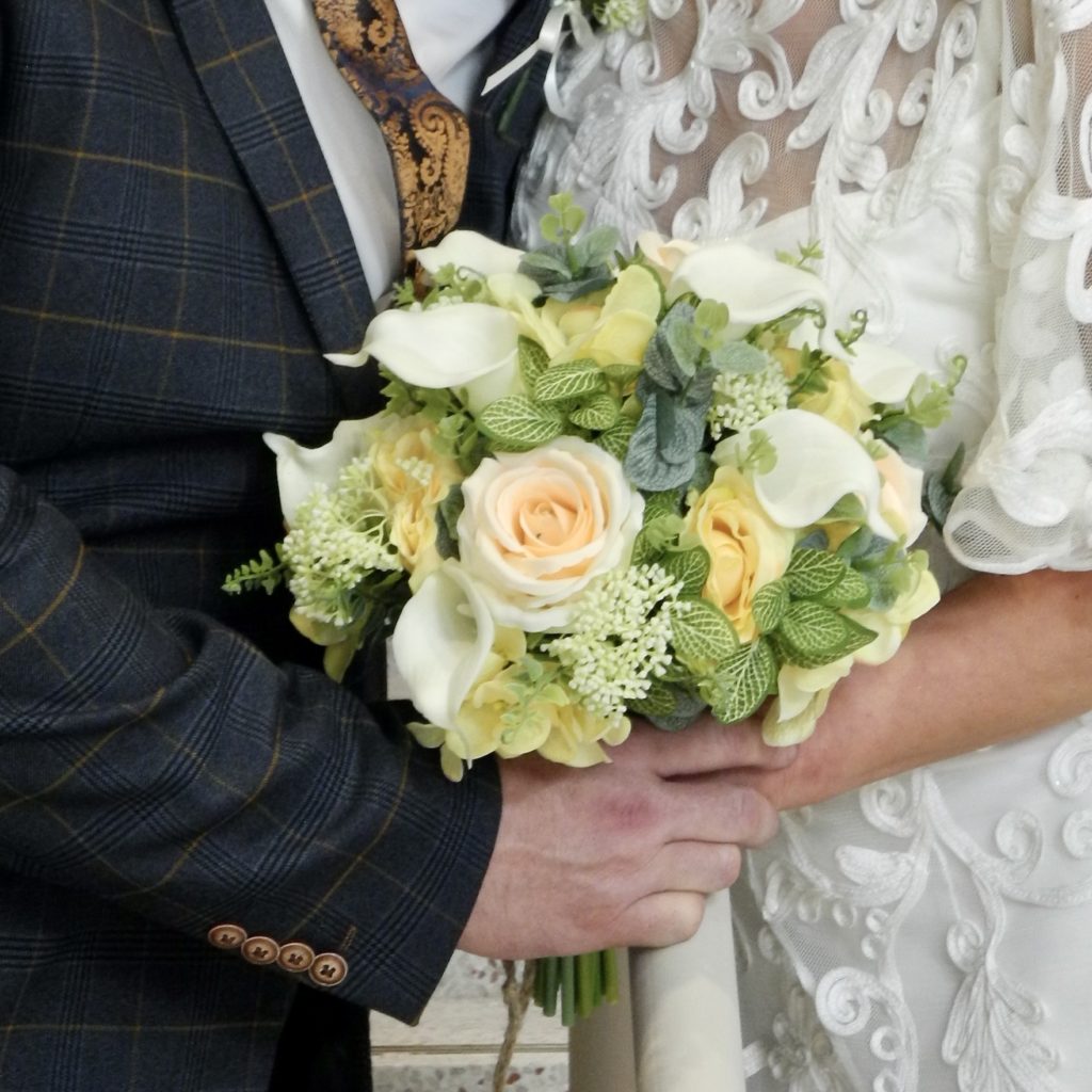 artificial silk flower bridal bouquet, hand tied posy style peach, ivory, soft yellows, apricot green. inc calla lily, roses, hydrangea, berry, eucalyptus and pilea