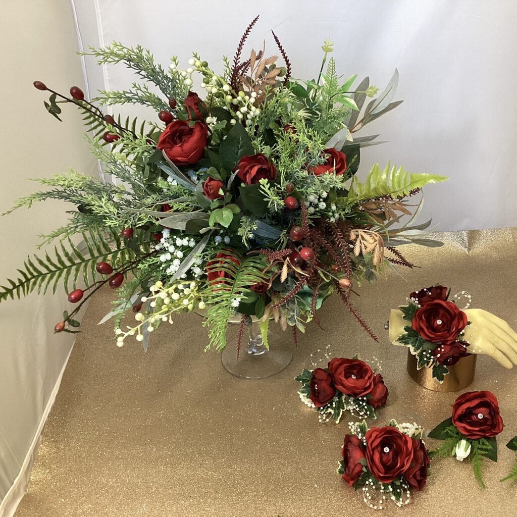 artificial silk flower brides bouquet, loose open natural hand tied design. reds, ivory, burgundy, green, inc rosehips, roses, berry, fern, eucalyptus