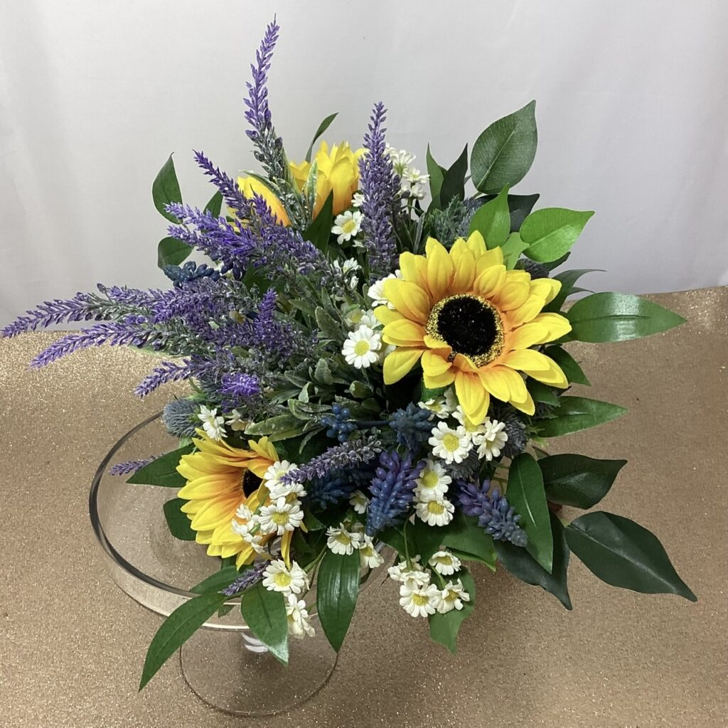 artificial wedding bouquet, hand tied posy style. purple, lavender, yellow & white, ficus, soft ruscus. sunflowers, lavender tanicteum & bluebells