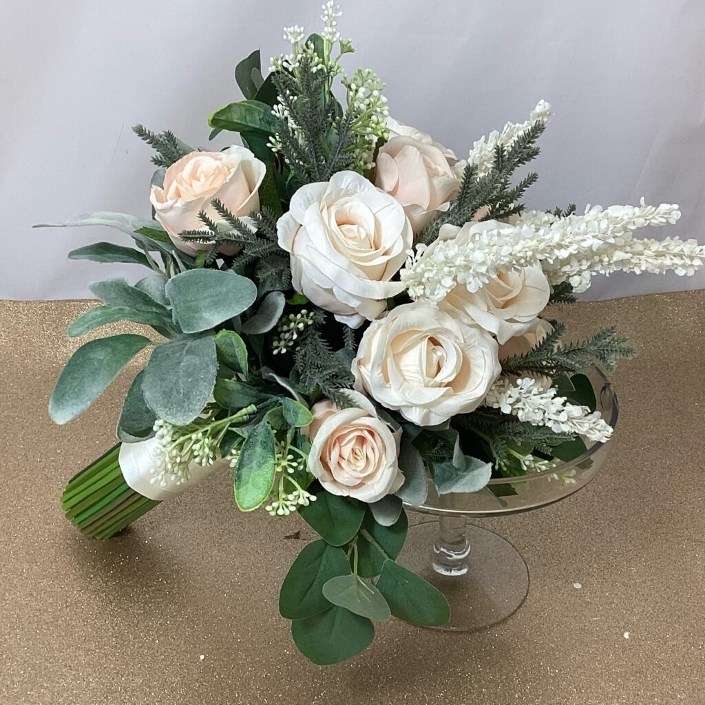 artificfial silk bridal bouquet, hand tied posy style. pastle colours, ivory, blush, peach inc veronica, roses, berries, spikey foliage, lambs ear & eucalyptus