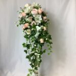 the Gabriella artificial pink rose, hydrangeas, ivory poppy and Scabiosa Brides Teardrop shower bouquet with trailing ivy leaves